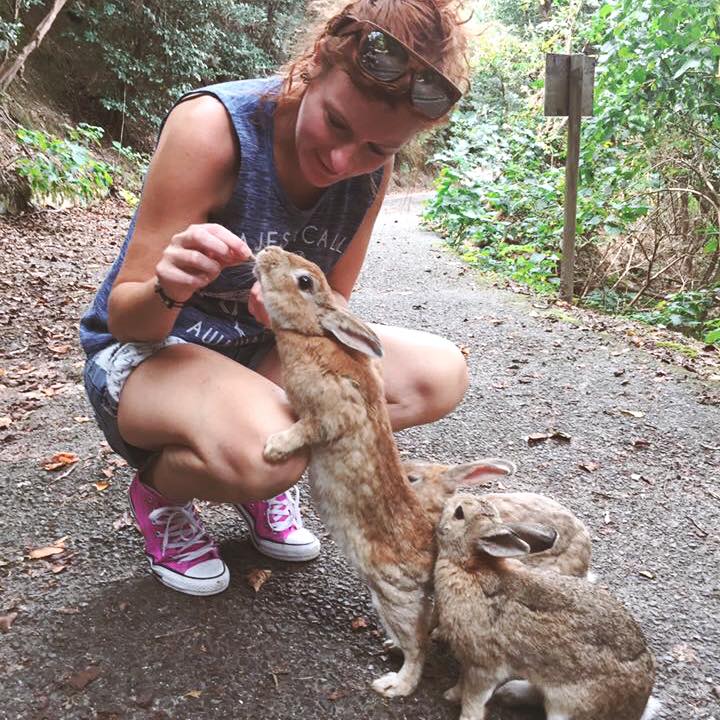 Anita Gait feeding a rabibit on Rabbit Island, Japan.